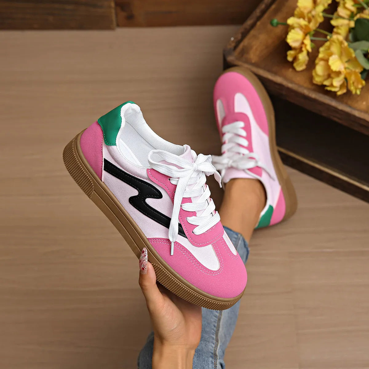 Lace-up sneakers in pink, white, green accents with black side stripe and gum sole