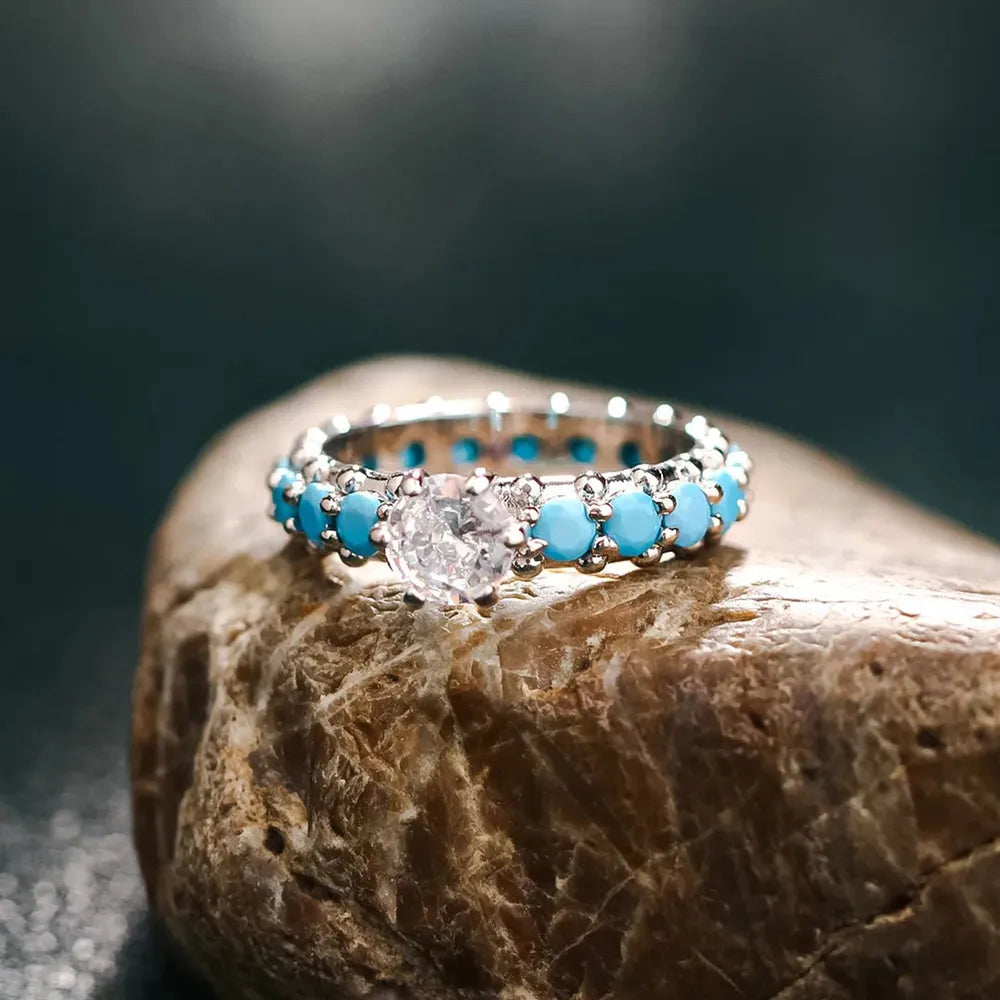Turquoise and clear zircon studded band ring with center stone
