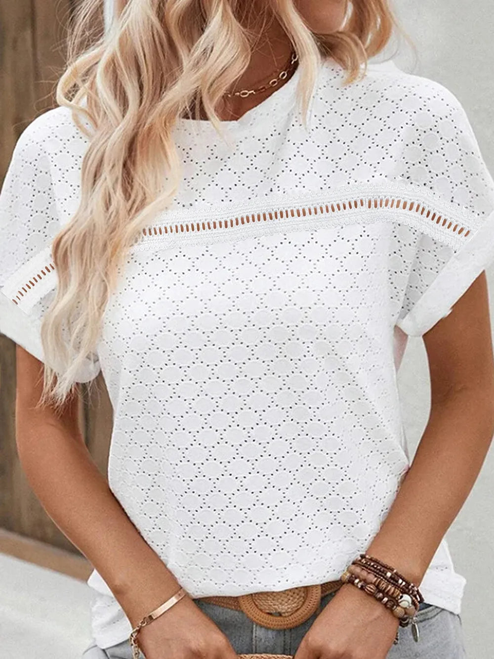 White eyelet short-sleeve top, round neckline, allover circular cutout texture