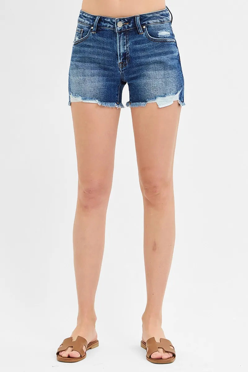 Dark denim low-rise button-fly shorts with frayed hem and light distressing