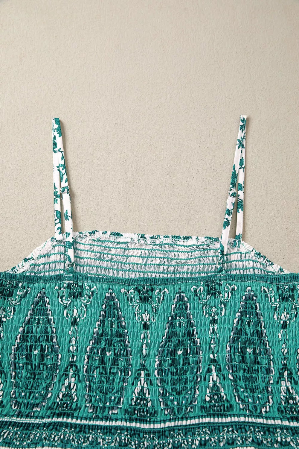 Turquoise shirred cami neckline with thin straps and textured smocking detail
