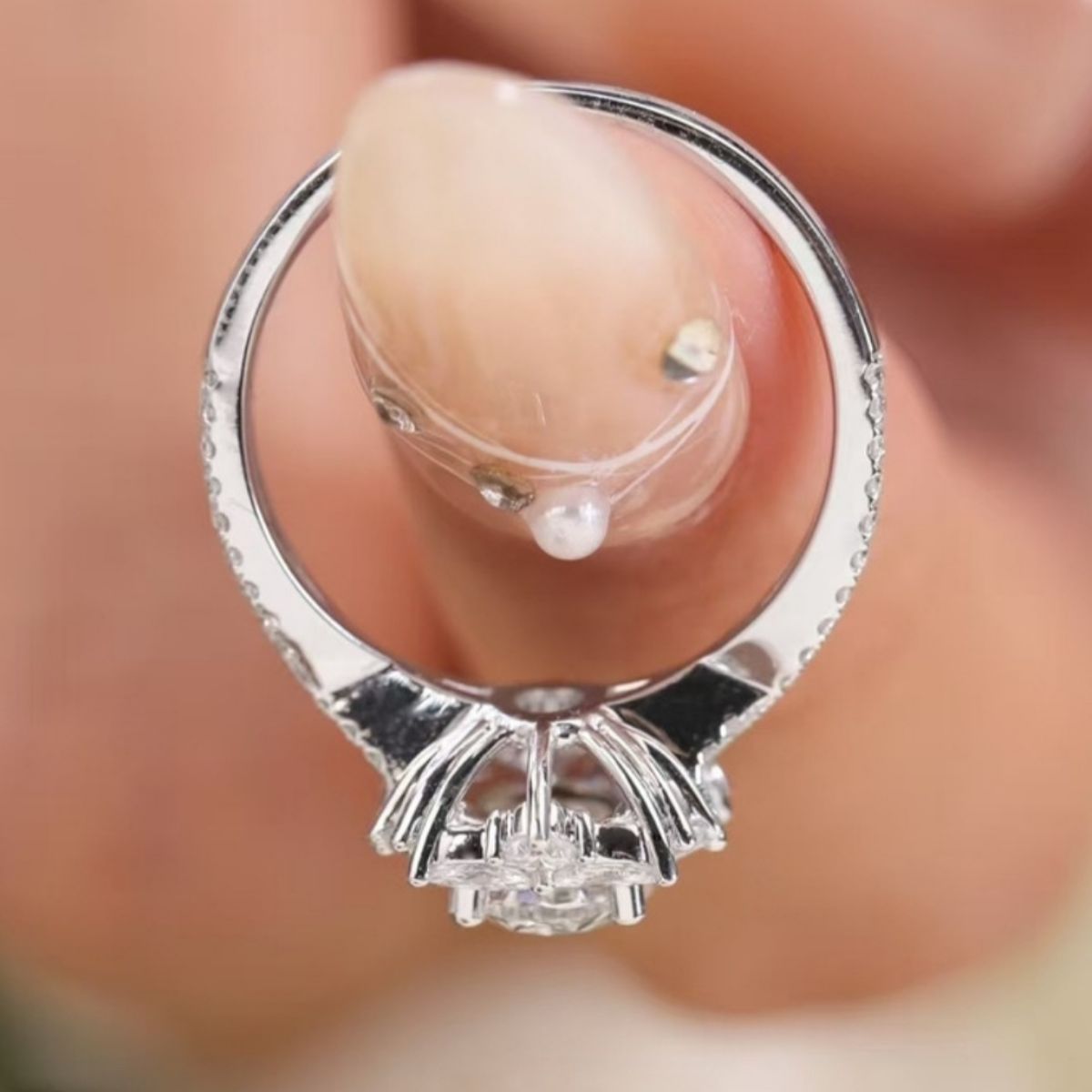 Moissanite ring side view showing prongs and open gallery under center stone